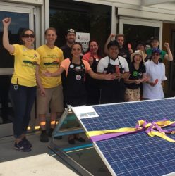co-op-staff-celebrating-solar-panels-768x776